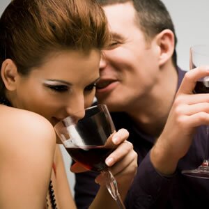 Hot woman drinking wine on first date with new guy.